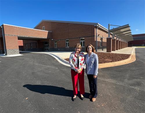 outside building pic of SPED director Susan Zinkhil and Bob Jones principal Sylvia Lambert