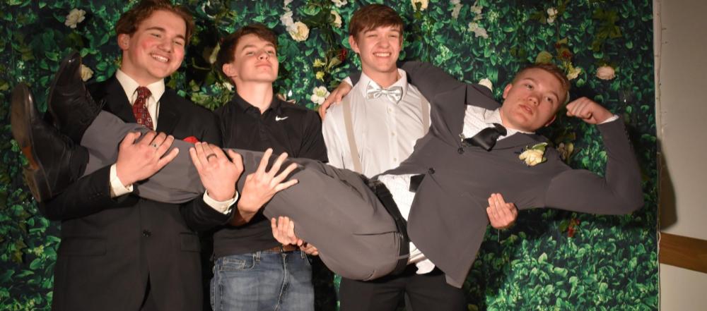 Silly pose  of boys at prom 2022