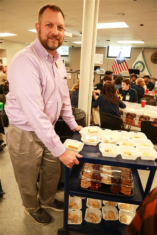 Mr. Yates serving desserts