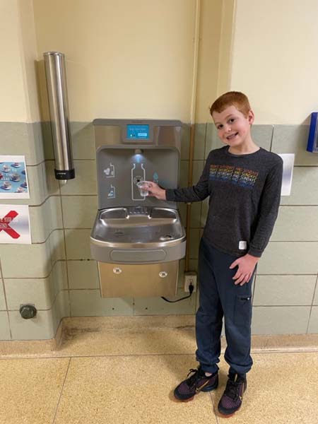 Student with water fountain
