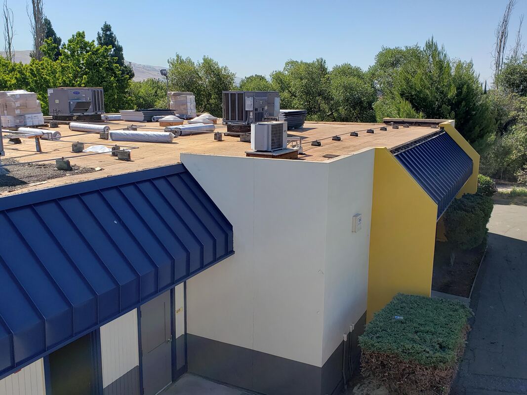 Roofing at MHS, prepped and ready to lay new roof membrane down