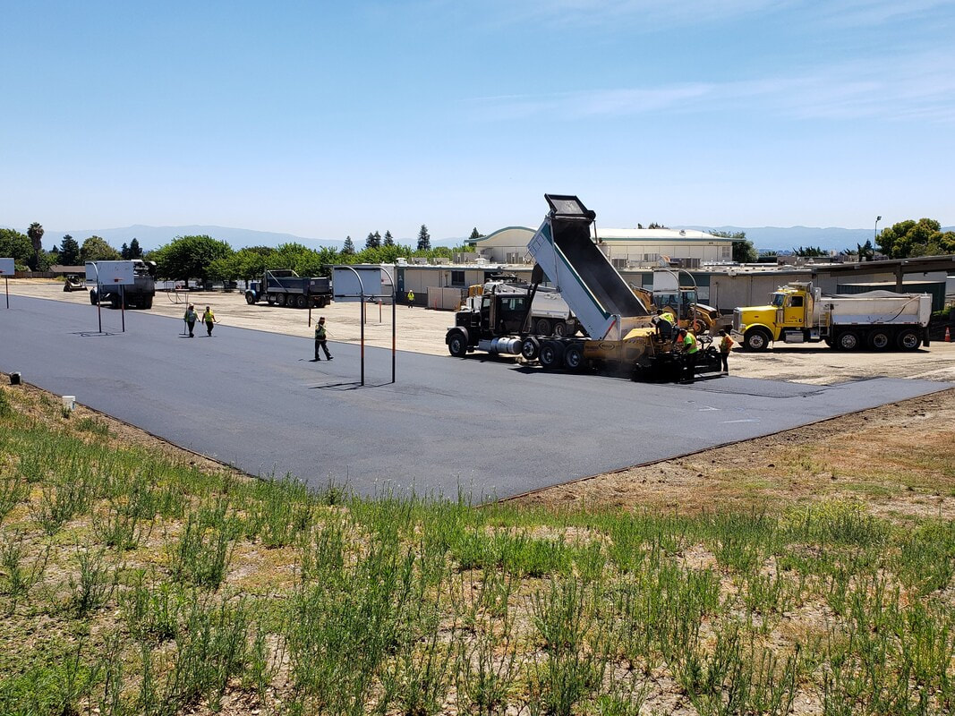 In the process of laying down asphalt at Russell