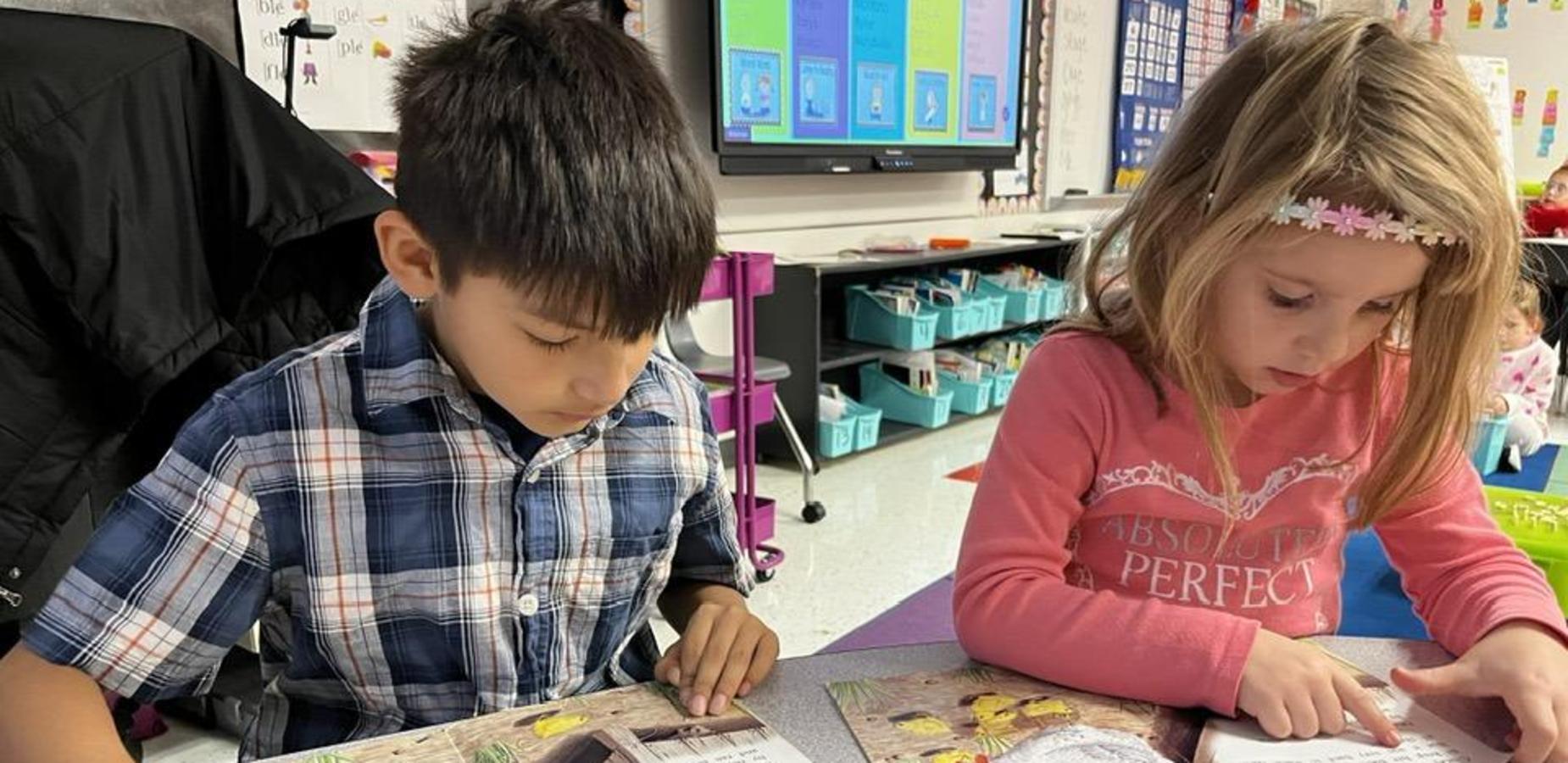 Students reading a book.