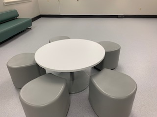 Photo of tables, chairs, and couch 