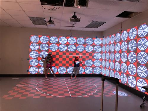 2nd grade students using the Immersive Room 