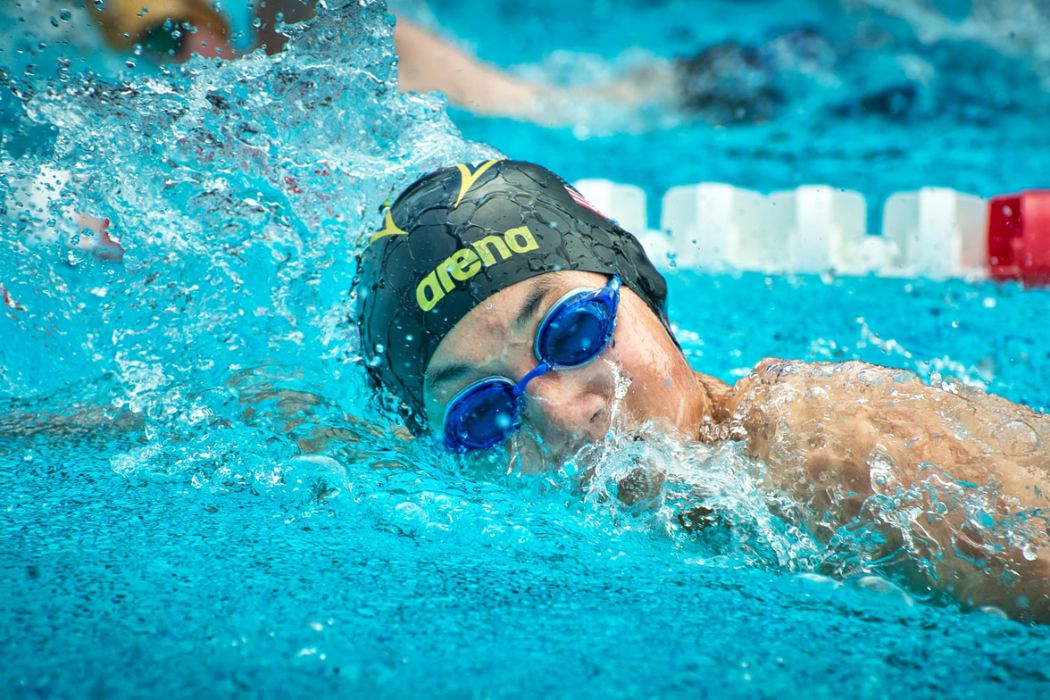 A person swimming in a pool.