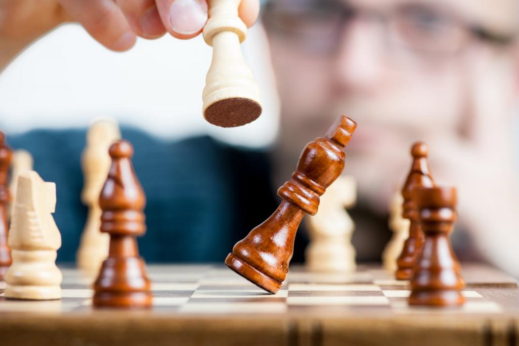 closeup of one chess piece knocking over another one