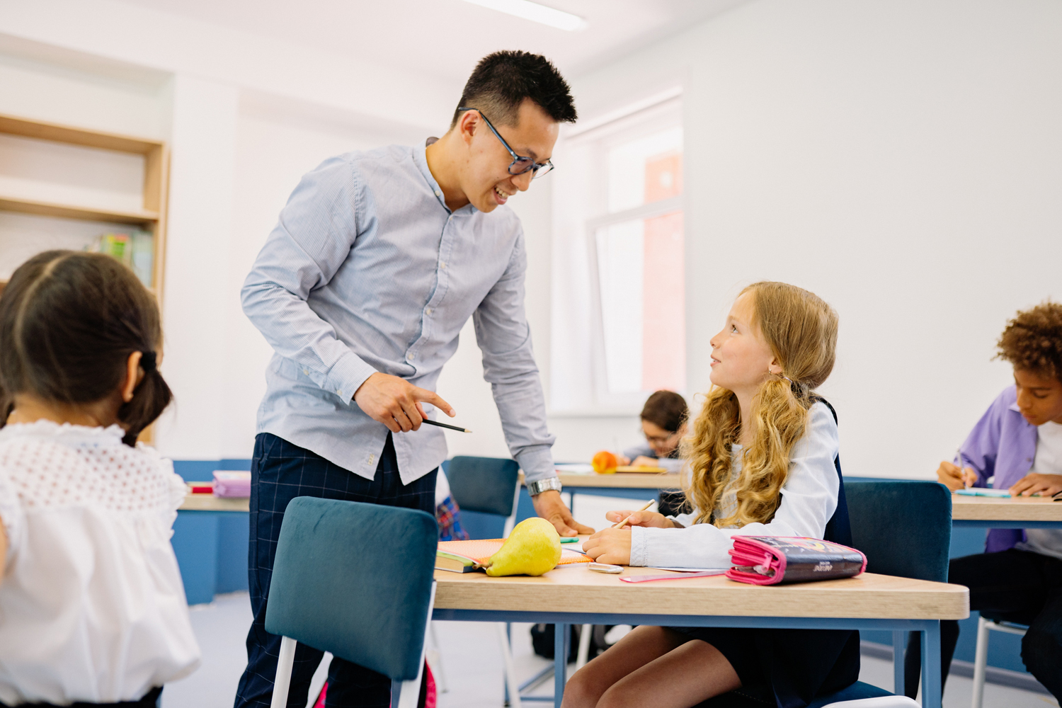 teacher helping student