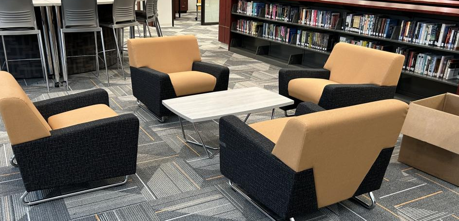 A library with a table and four chairs.