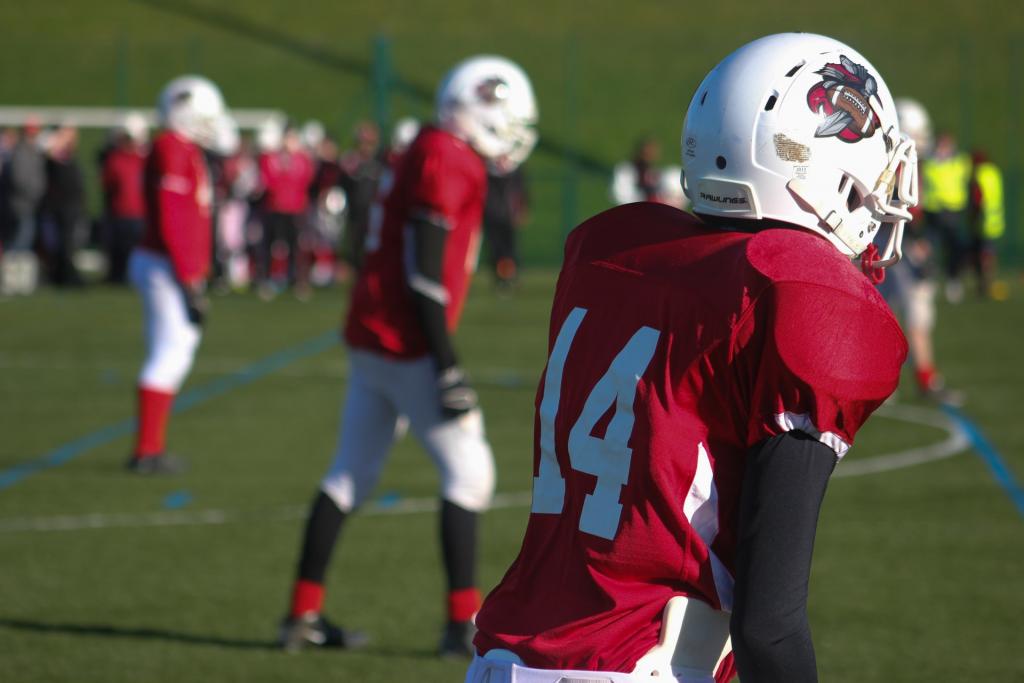 football players on the field during practice