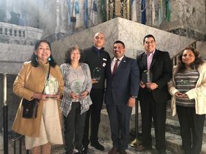 Nelly Mclauchlan receiving the 2019 Latino Legislative Award