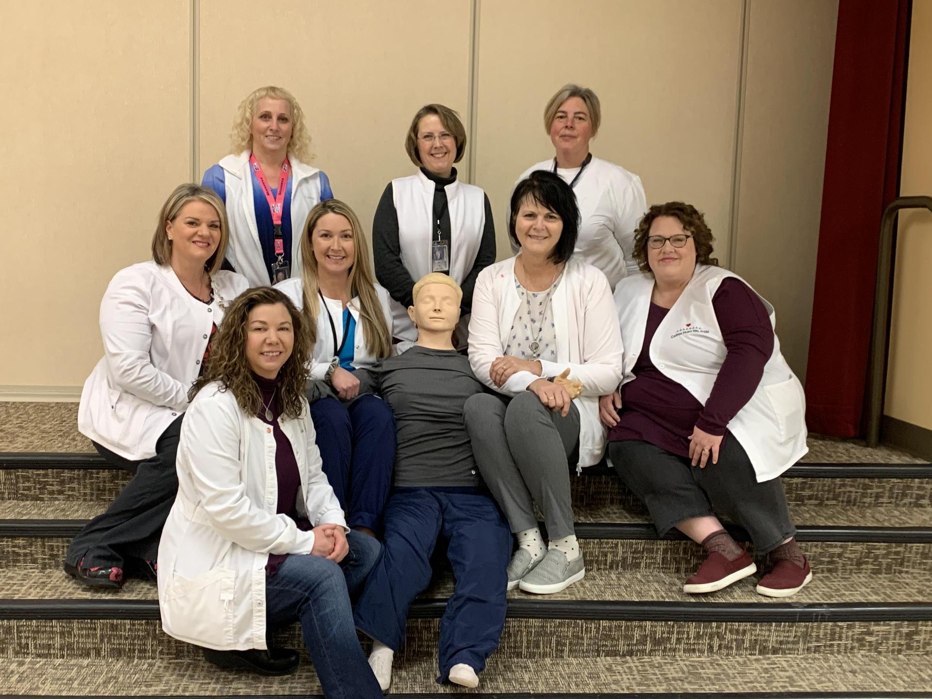 2020 MLSD School Nurses group photo around a medical test dummy.