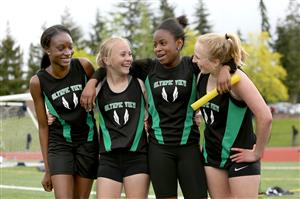 Olympic View track photo displaying four team mates smiling