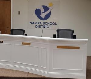 An empty trustee seat, with the NSD logo in the background.