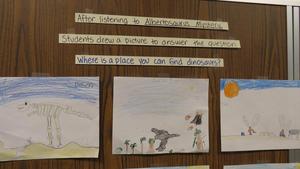 Student drawings at Centennial Elementary show dinosaurs.