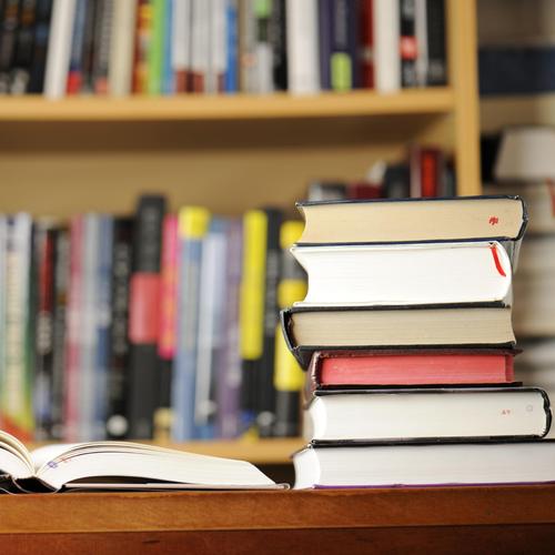 Stack of books on library desk