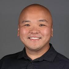 Jason Su headshot, dressed in black