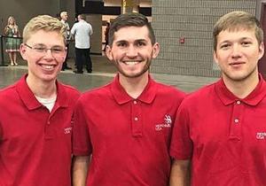 Ben Campbell is flanked by two fellow competitors at the SkillsUSA Competition.