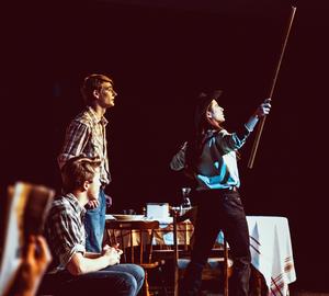 NHS students, two male, one female, perform a scene from \"The Rainmaker.\"