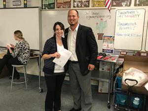 Male and female adult leaders pose during the event.