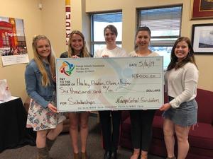Columbia recipients with their award check.