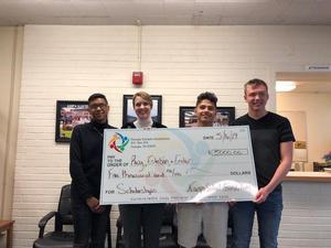 Nampa recipients with their award check.