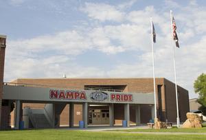 Nampa High Exterior, featuring the walkway painted with the name and logo.