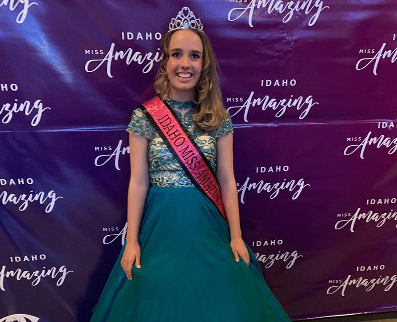 Sarah Triolo poses with her Miss Amazing sash and crown.