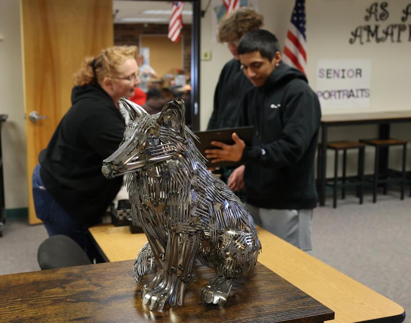 Sculpture of a fox made out of welded forks.