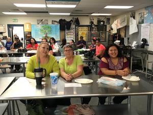 Adults watch the competition.