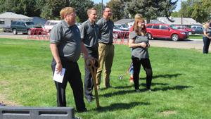 On Semiconductor representatives watch the ribbon-cutting ceremony.