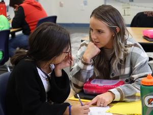 teacher works on-on-one with a student