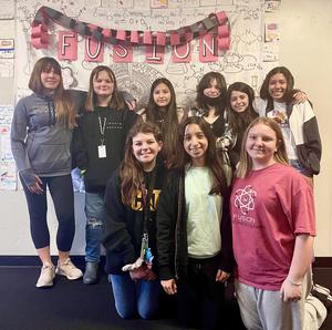 Members of the two teams that designed winning projects pose.