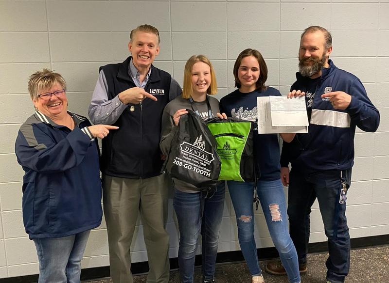 Addyson Fleenor and Jordyn Horak pose with their advisor and donor Shaun Christensen