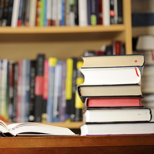 Stack of books on a library desk
