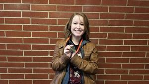 Jasmine Augustine with her trophy