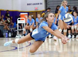 Alex Acevedo dives to return volleyball