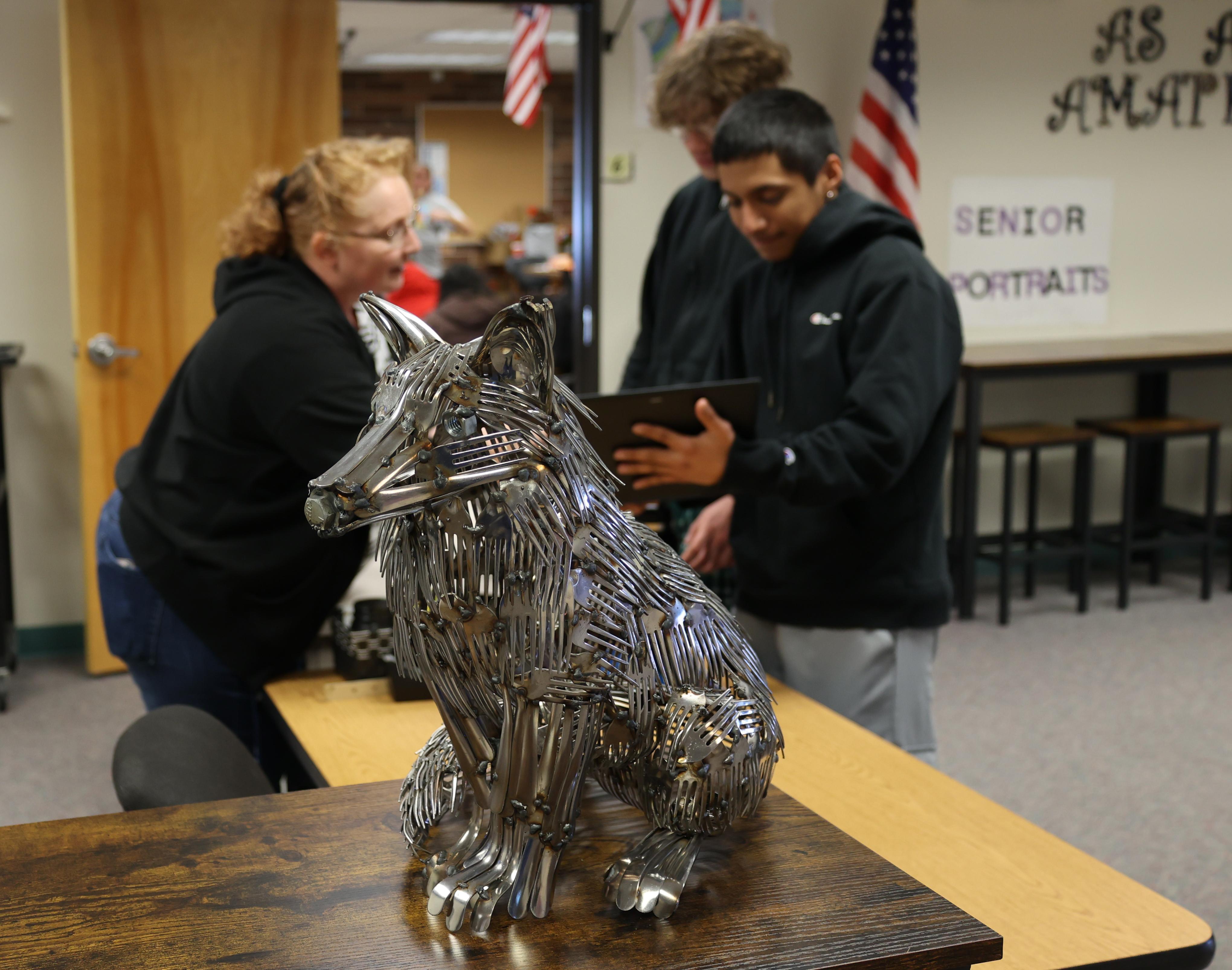 Sculpture of a fox made out of welded forks.