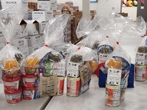 Food packages bundled into plastic bags.