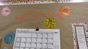 A bulletin board announces the Donut Hackers meeting.
