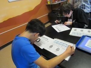 Fifth-graders analyze whorls in fingerprints.
