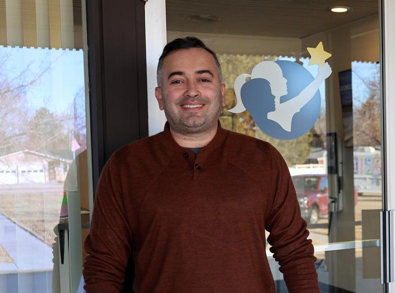 Jesus smiling in front of NSD logo