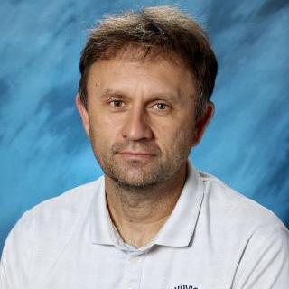 Headshot of Kevin Murphy in white shirt.