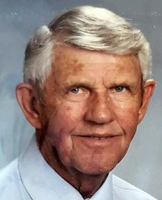 Merrill Anderson headshot in a white shirt and tie.