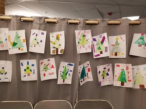 Child-drawn Christmas tress made from geometric shapes.