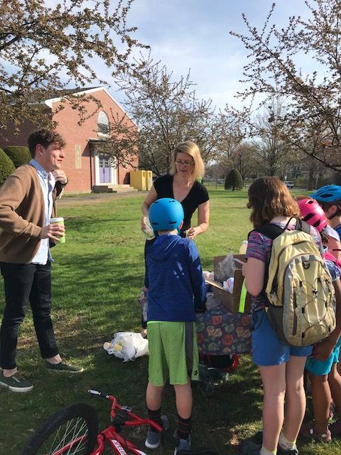 parent handing out treats to students