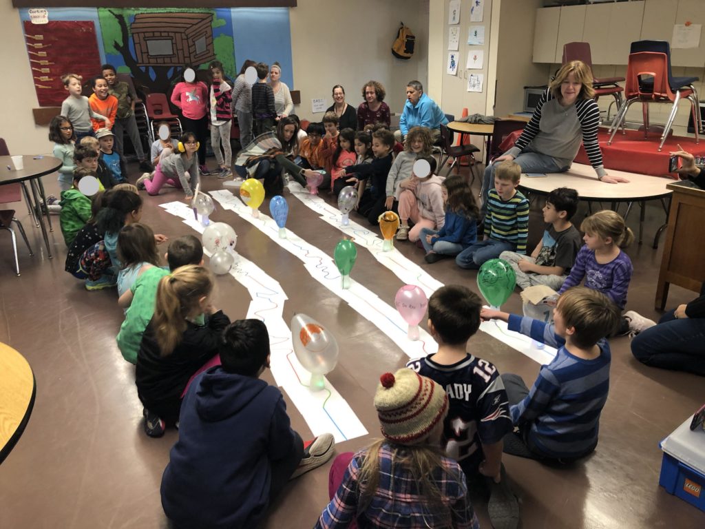 Students watch the robot parade.