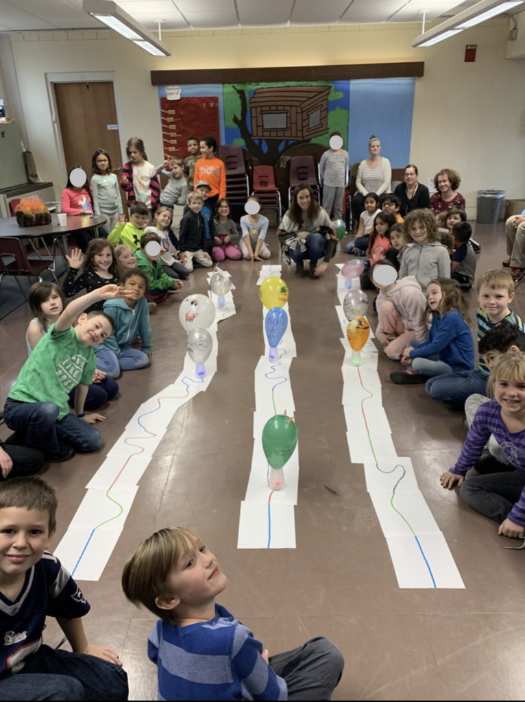 Full 2nd grade circled around the parade track and decorated robots.