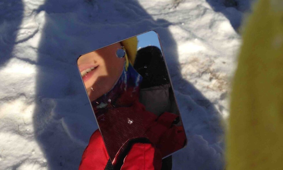 Reflected image of a kid's teeth in a mirror