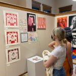 students looking at artwork.